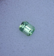 Load image into Gallery viewer, Vibrant Neon Green Vanadium Kornerupine - Emerald Cut - 0.49 ct.