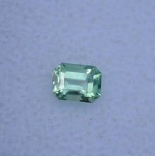 Load image into Gallery viewer, Vibrant Neon Green Vanadium Kornerupine - Emerald Cut - 0.49 ct.