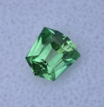 Load image into Gallery viewer, Piercingly Kelley-Green Vanadium Kornerupine Custom Gemstone - Original Design and Cutting by Scott Maier - 1.28 ct.