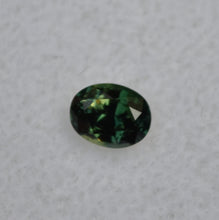 Load image into Gallery viewer, Parti-Color Australian sapphire - Half Yellow, Half Blue, and Shows as Deep Green - 0.64 ct.
