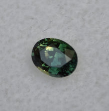 Load image into Gallery viewer, Parti-Color Australian sapphire - Half Yellow, Half Blue, and Shows as Deep Green - 0.64 ct.
