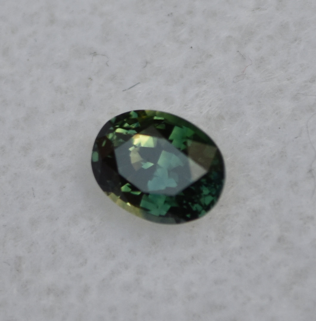 Parti-Color Australian sapphire - Half Yellow, Half Blue, and Shows as Deep Green - 0.64 ct.