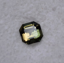 Load image into Gallery viewer, Dichroic Yellow and Green Kornerupine from Madagascar - 0.62 ct.
