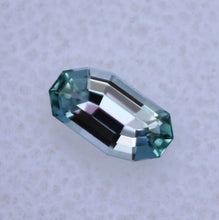 Load image into Gallery viewer, 0.66 ct. Eye Clean Chrome Kornerupine - Custom Wavy Step-Cut Gem
