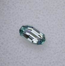 Load image into Gallery viewer, 0.66 ct. Eye Clean Chrome Kornerupine - Custom Wavy Step-Cut Gem
