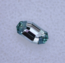Load image into Gallery viewer, 0.66 ct. Eye Clean Chrome Kornerupine - Custom Wavy Step-Cut Gem
