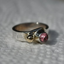 Load image into Gallery viewer, Punk Princess Ring - Hefty Sterling Silver, 14kyg Accent, and a Mahenge Garnet Bullet Cabochon - Stone and Ring by:  Scott Maier
