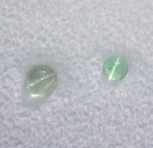 Load image into Gallery viewer, Set of Two Round Vanadium Bearing Cats Eye Kornerupine Gemstones - 0.71 ctw.
