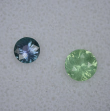 Load image into Gallery viewer, Fantastic Pairing of Chrome and Vanadium Kornerupine Round Gems - 1.4 ctw.  BOTH faceted by Scott Maier in Vermont
