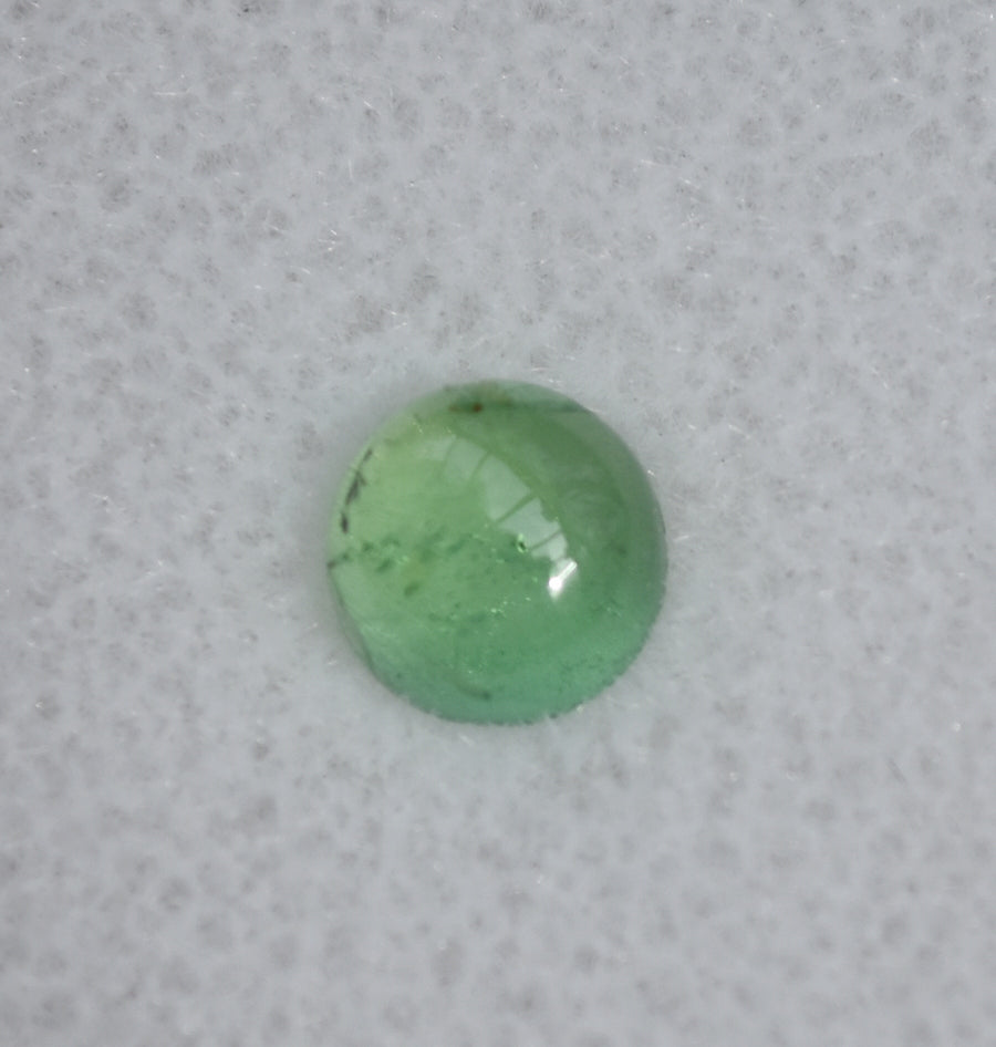 Saturated Green Vanadium Kornerupine Cab - Round High Dome - 1.03 ct.