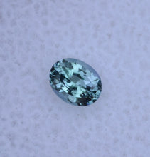 Load image into Gallery viewer, EYE CLEAN Chrome Kornerupine Gemstone - Classic Oval - Dichroic - 0.28 ct.
