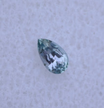 Load image into Gallery viewer, Chrome Kornerupine Pear Shape - Remarkably Clean, with Visible purple and Green - Good Cutting; 0.23 ct.
