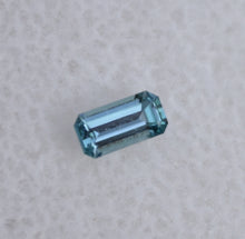 Load image into Gallery viewer, Chrome Kornerupine Gemstone - Long Emerald Cut - Purple/Blue Color - 0.16 ct.
