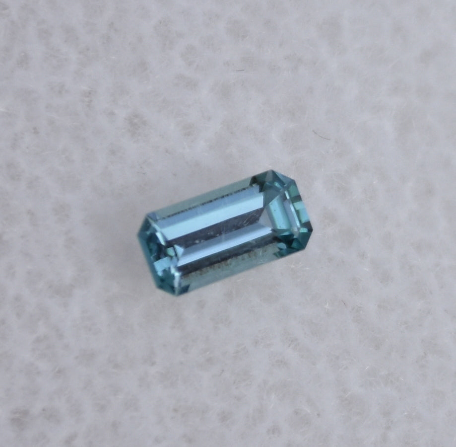 Chrome Kornerupine Gemstone - Long Emerald Cut - Purple/Blue Color - 0.16 ct.