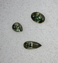 Load image into Gallery viewer, Madagascar Kornerupine Parcel - Dichroic Green Gems - SUPER Clean - 0.78 ctw.
