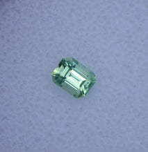 Load image into Gallery viewer, Vibrant Neon Green Vanadium Kornerupine - Emerald Cut - 0.49 ct.
