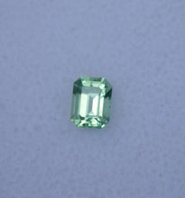 Load image into Gallery viewer, Vibrant Neon Green Vanadium Kornerupine - Emerald Cut - 0.49 ct.
