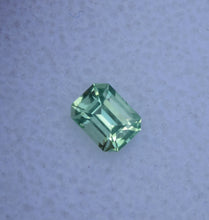 Load image into Gallery viewer, Vibrant Neon Green Vanadium Kornerupine - Emerald Cut - 0.49 ct.
